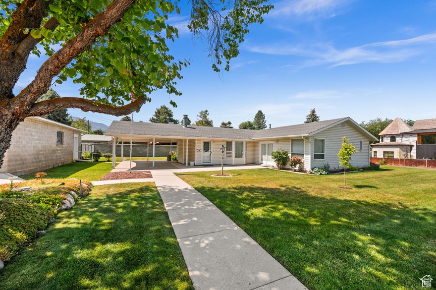 Welcome to single-level living in Cottonwood Heights! This 3 bed, 2.5 bath rambler spans 1,589 sq ft on a beautifully landscaped .25 acre corner lot with mountain views. Enjoy vaulted ceilings, a cozy fireplace, and a spacious primary suite with ensuite bath, walk-in closet, and sitting area. Detached garage, side patio, fenced area for pets or garden, and mature trees complete the outdoor charm. Nestled near Big Cottonwood Canyon with easy access to skiing, golf, parks, and I-215. This home blends comfort, convenience, and location.