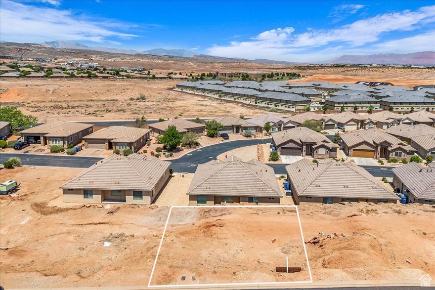 Bring your own builder! Discover the perfect opportunity to build on this improved residential lot located in the desirable Joshua Tree at SouthGate subdivision. Located just off of the 15th Fairway at SouthGate, Lot #13 offers stunning views of the surrounding red rock landscapes and Pine Valley Mountains, nestled in a quiet, established neighborhood. With nearby access to golf, hiking, biking trails, and the convenience of being minutes from shopping, dining, and downtown St. George, this location combines natural beauty with urban accessibility. *Square footage figures are provided as a courtesy estimate only. Buyer is advised to obtain an independent measurement.