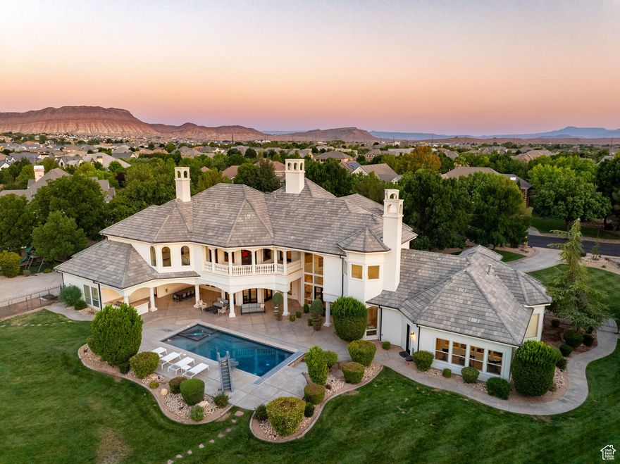 Extremely rare 1.82-acre lot in Washington Fields with stunning Pine Mountain Valley views. Extensive remodel by a local high-end builder brings timeless elegance and modern luxury throughout. Step inside to soaring ceilings, walls of glass, and a dramatic curved staircase. The main home features a grand primary suite plus four private bedroom suites, with a separate casita for guests. Highlights include an RV garage, advanced home automation, a state-of-the-art theater, rich hardwood floors, and four new HVAC systems. Outdoors, enjoy a sparkling pool with new slide and heater, built-in BBQ, lush lawns, mature trees, playground, and basketball hoop. Set on a peaceful cul-de-sac with no HOA, this estate blends rare land, breathtaking views, and refined design.