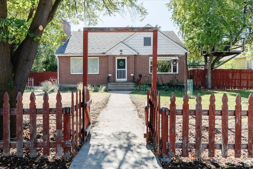 Absolutely charming! This classic brick home with a picket fence has all the features you hope for in a home: beautiful hardwood floors, great outdoor space, right-sized bedrooms, plenty of storage, well-maintained and fully livable. You can't beat this location! A few steps from the Island Market and Central Park, and just a few more to downtown Logan. Easily walk to nearly everything you need. Yet in a completely residential neighborhood. Easy parking off of Center St also. You've got to see this one; it's a whole vibe!