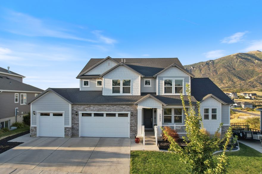 SunCrest is Draper's best-kept secret. Nestled in the mountains high above the inversion, it's quiet, peaceful, and has absolutely breathtaking views...and this home captures those views from every single window. The "Tessa" floor plan is known for its open layout, large kitchen, and main floor primary suite, but this one has some additional features that are to die for. 9-ft ceilings, a gas cooktop, wall oven,  butler pantry, and an en-suite bathroom for one of the upstairs bedrooms are not the only perks. No back neighbors makes this home incredibly private and allows for protected and uninterrupted views. The 3-car garage with EV charger and storage, battery-powered roller shades, steam humidifier, and water softener add comfort and convenience. Outside, enjoy raised garden boxes, a private basketball court, and protected mountain views. SunCrest offers cool mountain air, miles of trails, and parks - all just minutes from both Salt Lake and Utah Valley.