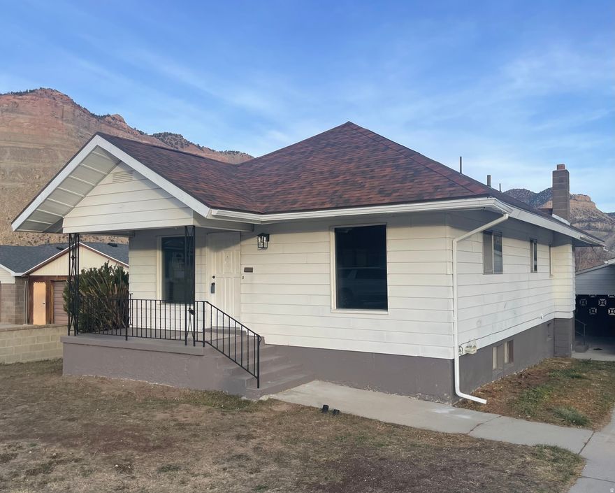 Beautifully remodeled home in the desirable town of Helper. Located on a secluded street with mountain views all around. Enjoy a covered deck, covered/private porch, 3 car extra tall garage and a basement with its own rear access. Inside you'll find a remodeled interior with new paint, new baseboards, new flooring, new appliances, new can lighting, a 3rd remodeled bathroom downstairs, 2 laundry rooms, and 2 large living areas. The floorplan is functional and comfortable. Tons of storage not found in many homes at this price range.  The kitchen is large, updated and open. The house has lots of windows that bring in plenty of natural light.  Priced to sell. Price is firm.  Owner/Agent.