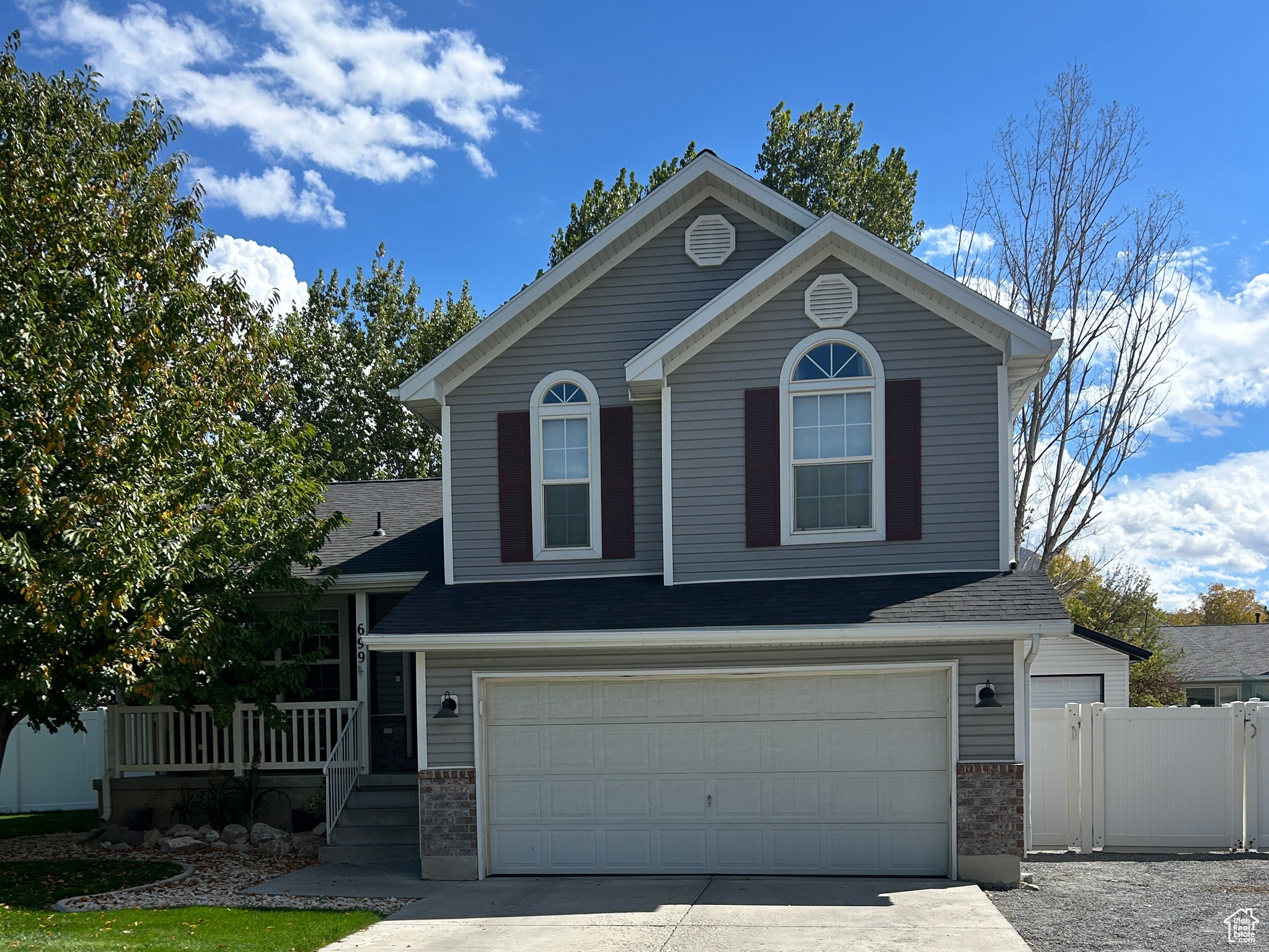 Multi-level home in Stansbury Park with bright open layout, spacious great room, large windows, and seamless indooroutdoor living. Fully fenced 0.25-acre lot offers RV parking, garden space, chicken coop, extra garage, and modern finishes throughout.