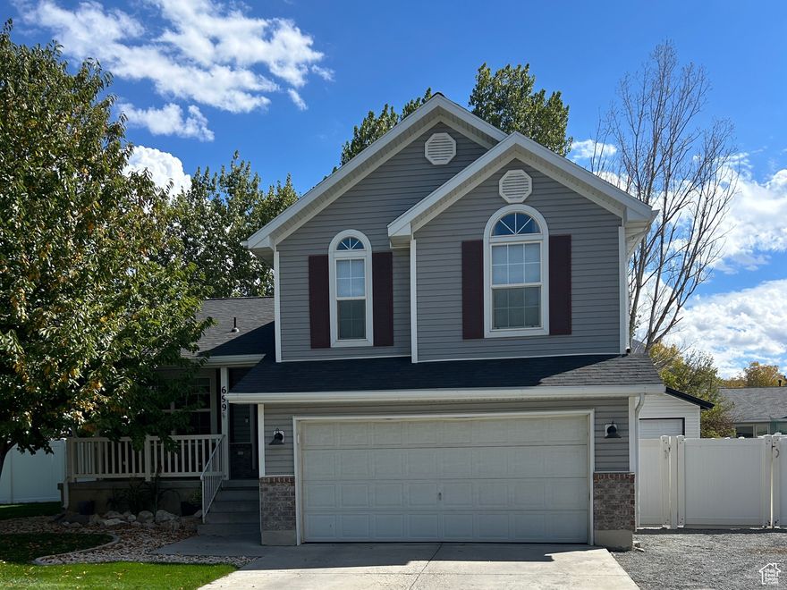 Multi-level home in Stansbury Park with bright open layout, spacious great room, large windows, and seamless indooroutdoor living. Fully fenced 0.25-acre lot offers RV parking, garden space, chicken coop, extra garage, and modern finishes throughout.