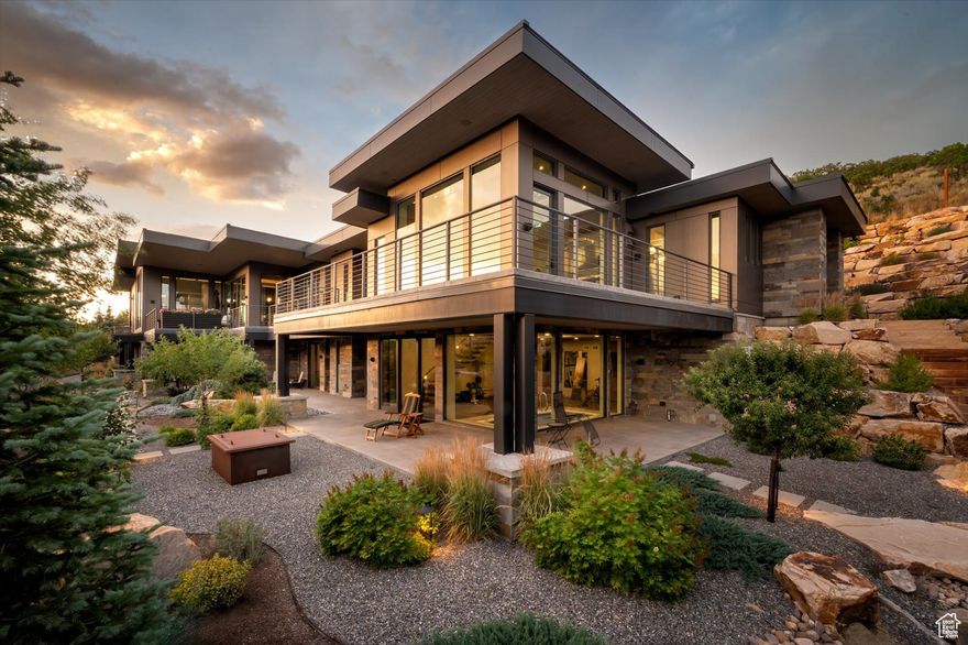 Perched on a rare 1.58-acre private estate just minutes from Deer Valley Resort and Park City Mountain, this exceptional home offers the ultimate Park City lifestyle. With sweeping, unobstructed views of the ski runs and almost no neighbors in sight, it's a sanctuary of privacy and beauty.  A gated, heated driveway leads you to this fully furnished 4-bedroom residence with an office, second kitchen, and radiant heated floors throughout. Inside, the home exudes elegance with extensive use of marble in baths, kitchens, and gathering spaces. Walls of glass frame the surrounding mountains, while multiple heated decks create seamless indoor-outdoor living.  The grounds are a work of art-lush, mature landscaping forms zen-inspired gardens anchored by a massive cascading waterfall, creating a spa-like atmosphere year-round. The second kitchen offers convenience for entertaining, and the property's expansive footprint ensures both space and serenity.  This is a once-in-a-generation property-a rare combination of size, privacy, and breathtaking views in a location just minutes from world-class skiing, dining, and shopping. Buyer to verify all to their satisfaction.