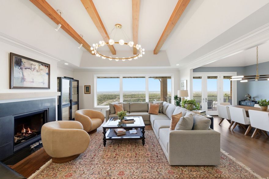 Perched high on Salt Lake's desirable east bench, this beautifully designed home offers a rare combination of luxury and sweeping views. Nearly every room captures absolutely stunning vistas of the Oquirrh Mountains, the Great Salt Lake, and downtown Salt Lake City. Inside, natural light pours through expansive picture windows, creating a seamless indoor-outdoor feel. The chef's kitchen features granite countertops, sleek European-style appliances, dual sinks, and ample storage, flowing effortlessly into the dining area, office, powder bath, and an inviting great room. Step out onto the spacious deck-perfect for entertaining or relaxing at sunset. The main-level primary suite is a private retreat with a steam shower, dual vanities, walk-in closet, and breathtaking views. Pella Designer Series windows with built in shades provide enhanced comfort and privacy. The lower level offers four large bedrooms, two updated bathrooms, flexible living space, and the convenience of a second laundry area. Outside, tiered landscaping creates usable yard space for entertaining, play, or future amenities-all set against a dramatic mountain backdrop. Located minutes from downtown Salt Lake City, the University of Utah, and world-class skiing  with Park City just a short drive away-this home delivers the perfect blend of convenience and elevated mountain living.
