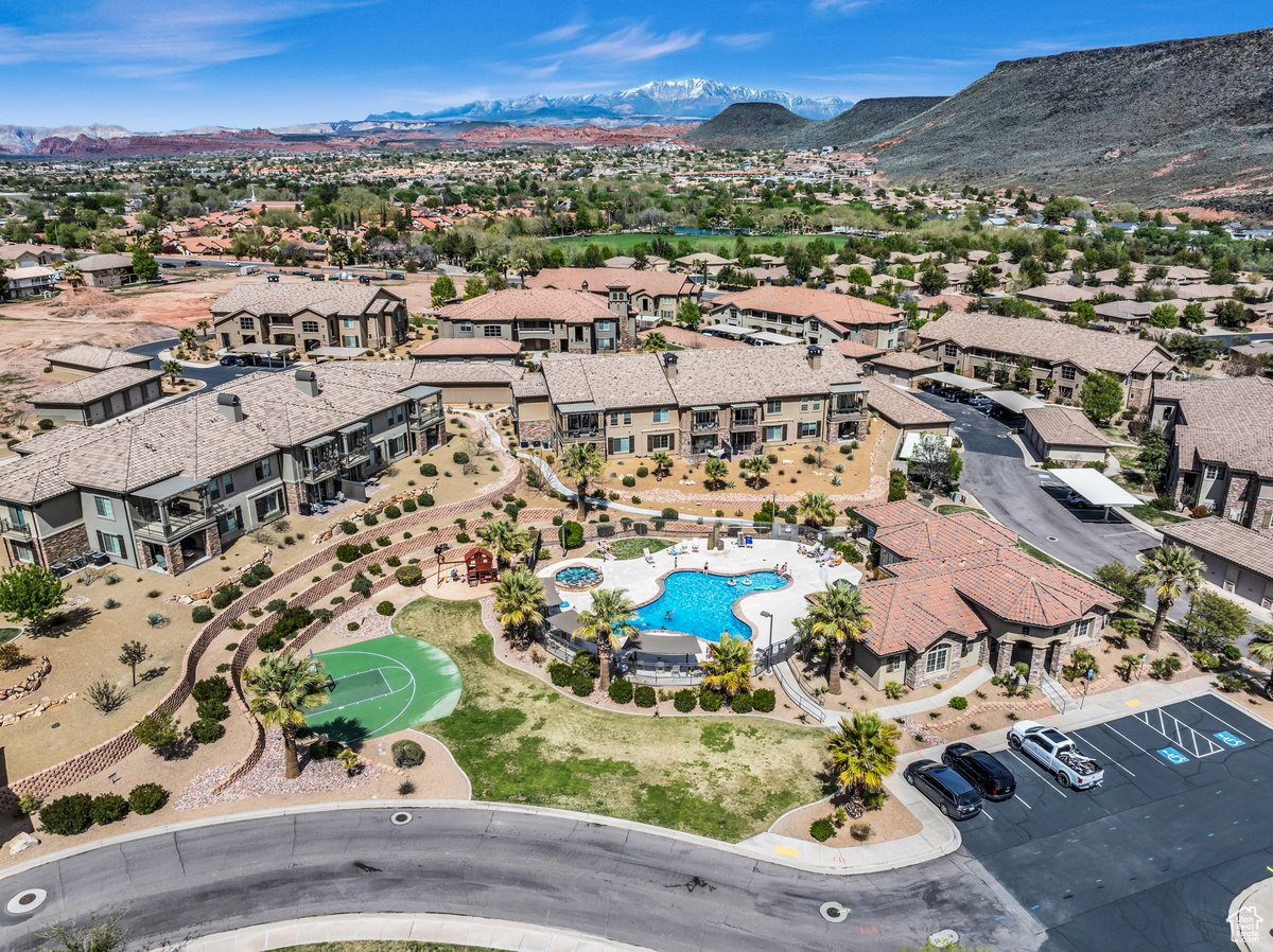 Don't miss this incredible Pelican Hills condo, centrally located with breathtaking mountain and city views. The open and bright floor plan features tall ceilings, a cozy gas fireplace, and matching tile throughout. The spacious primary suite boasts a soaker tub, walk-in shower, and a large walk-in closet, while the guest bedrooms are generously sized with ample storage. Enjoy a modern kitchen with quartz countertops and a bar-stool seating area, opening to a large laundry room with extra storage. Enjoy this communities amazing amenities including pickleball and tennis courts, a theater room, a full kitchen and common area, basketball court, pool, hot tub, and a weight room. Complete with a 1-car garage, carport, and easy access to Snow Canyon and city trails, this home offers the best of St. George living! All appliances, washer, dryer, living room TV and sound system included. Buyer to verify all information, deemed reliable, however buyer to verify all info including utilities, rental restrictions, and HOA information if applicable.