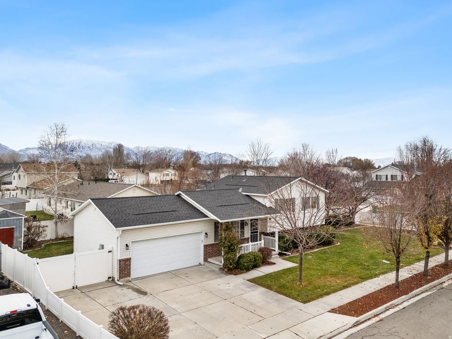 Hard to beat in Lehi! This 4 bed / 3 bath home sits on a corner lot just steps from Somerset Park; perfect for outdoor fun and friendly neighborhood living. Enjoy peace of mind with a new roof & gutters, fully fenced yard, and no HOA restrictions. Washer/Dryer included. Smart-home ready with voice/app remote access control. The yard is immaculate with beautiful landscaping, gathering spaces, and room for pets and a garden. Plenty of parking space. A rare opportunity at this price. Come take a look!  Square footage figures are provided as a courtesy estimate only. Buyer is advised to verify all.