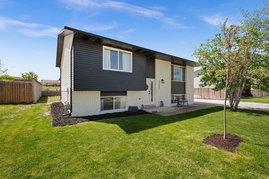 Beautifully updated 4-bedroom home near the new Magna Regional Park. Set in a wonderful neighborhood this home backs onto open space - no backyard neighbors! Fully remodeled in 2023 with quality and care and lovingly tended by the current owners - new doors and trim work, light LVP tasteful wood-look flooring, replacement windows, all new kitchens, updated baths, and recent appliances! Both kitchens have quality cabinetry with brass fixtures and quartz countertops! Gas range up, flat-top electric range down, both with built-in microwave ovens and dishwashers! Two spacious bedrooms up with a beautiful tiled bath and Wedgewood blue cabinets. Downstairs find a comfortable family room with a tidy nook kitchen - perfect for entertaining - two bedrooms, aand a large remodeled 3/4 bath with a walk-in shower, penny-tile floor, and marble tile enclosure. Pretty, well tended, front yard and a nice private back yard (chickens are not included!). Tons of storage, including a large backyard shed for gear. Wide driveway for lots of off-street or RV parking, or easily add a 2-car garage. Nicely landscaped with mature trees and a new little maple. Appliances from both kitchens are included! Sellers have found their next home and have priced this to sell!