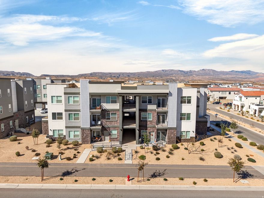 This stunning third-floor condo boasts incredible views of St. George's iconic red rock formations, all at an unbeatable price. The open layout is filled with natural light and includes a modern kitchen with updated appliances. The spacious primary suite features an ensuite bathroom and a walk-in closet. Relax on your private balcony and take in the peaceful desert scenery. The community offers fantastic amenities, including a 2.5-acre lagoon perfect for paddleboarding, parks, pickleball courts, two additional pools, hot tubs, and a gorgeous clubhouse. Enjoy the perfect mix of comfort, style, and adventure in the heart of St. George. Furniture options are available!