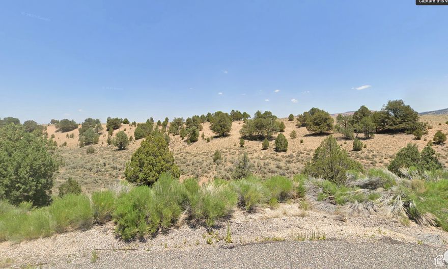 2.18-acre lot in Garfield County's only gated community. Roads, power, and water will be completed Spring 2025. Located on the Paunsaugunt Plateau at 7,000 ft, this property offers year-round paved access, scattered trees, and stunning views of Sunset Cliffs and Cedar Mountain. Just 15 minutes from Bryce Canyon. Horse-friendly, cabin-style community with short-term rentals allowed (with county approval).