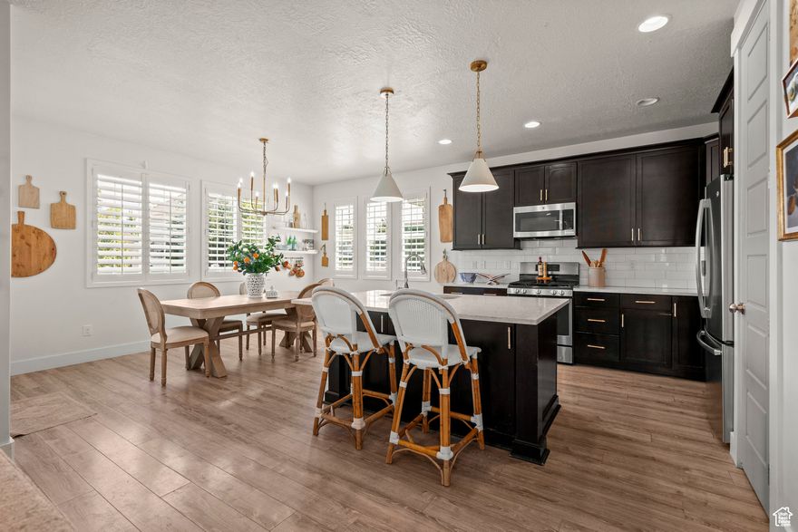 Come see this incredible turn-key home! This home has everything you're looking for: a beautiful kitchen with incredible hard surface countertops, a huge master bath, tile bathroom floors, a massive walk-in closet, a private backyard with a covered patio,  finished basement, and lots of garage storage! Call or text for a private tour!
