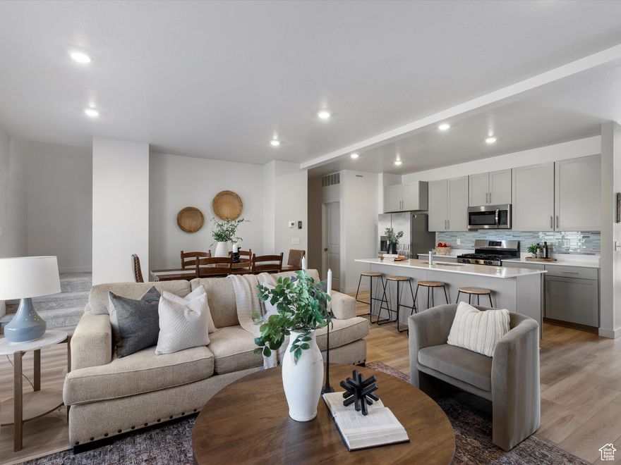 Modern Townhouse Living in the Heart of Heber Valley. Discover mountain living with convenience and style in this 3-bedroom, 3-bathroom townhouse, ideally located just eight minutes from Deer Valley's East Village. Whether you're seeking a full-time residence or a mountain retreat, this home offers comfort, upgrades, and easy access to year-round adventure. Inside, you'll find thoughtful details throughout, including a beautiful tile backsplash in the kitchen, a welcoming fireplace, and a water softener with a refill tank conveniently located in the garage, no more hauling heavy salt bags downstairs. The garage also features epoxy floors for durability and function. A radon mitigation system adds peace of mind, while the basement is plumbed for an additional bathroom, offering future expansion potential. Step outside to enjoy miles of paved walking trails, plus nearby mountain biking and hiking trails that bring the Heber Valley lifestyle right to your doorstep. For buyers seeking a move-in-ready option, all furniture is available for purchase via a separate bill of sale. This townhouse blends modern upgrades with unmatched access to recreation, an ideal place to call home in one of Utah's most desirable mountain valleys. Square footage figures are provided as a courtesy estimate only. Buyer is advised to obtain an independent measurement.