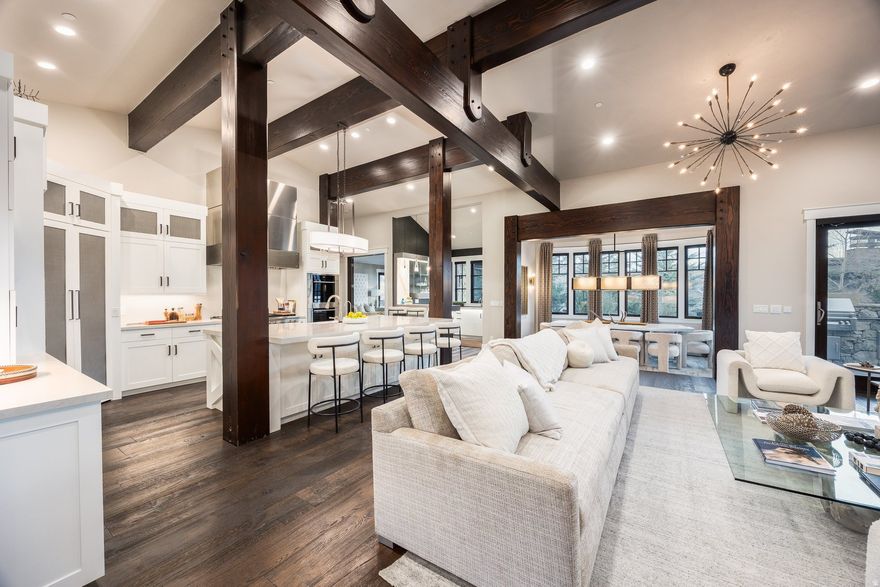 Full Golf Membership Available! This is the stylish home you deserve. Enjoy quiet evenings watching colorful sunsets, intimate dinners with close friends, and throw memorable parties to celebrate life's special milestones. The welcoming great room is designed to impress, from the sophisticated living room with floor to ceiling fireplace, well equipped Chef's kitchen and the architecturally designed illuminated bar. Several outdoor decks and patios allow you to enjoy Park City's mild summer evenings for al Fresco dining, hot tubbing after a long day on the slopes or the links, or drinks and deep conversations by the firepit.  The lower level has plenty of room for family and guests, with a second living area with a western inspired bar, three ensuite bedrooms, and a second kitchen. A state of the art golf simulator and full gym will keep your game sharp year round.  Special features of the home include an outdoor kitchen, two steam showers, Jacuzzi infrared sauna, conditioned wine room and an oversized heated garage. This home has a Full Golf membership available, giving you access to all of Promontory's world class amenities, including three golf courses, ski lodges at Park City and Deer Valley, spa, fitness, golf and dining clubhouses, beach club and Kids cabin.