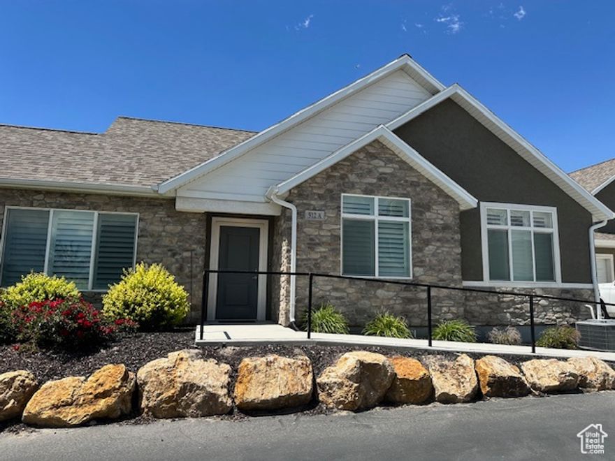 Find your new home nestled in the heart of Saratoga Springs. The Villas at Legacy Farms, a 55+ community, offers convenience, low maintenance and is single level living at its finest. In addition to landscaping and snow removal this community offers a clubhouse with  pool, gym, movie theater, library and a space to gather just steps from your new home!  Carefully planned this home is ADA accessible with extra wide hallways and doors for easy maneuverability and peace of mind. This Villa includes a master suite with separate shower and soaking tub, and generous walk in closet. The spacious living areas include vaulted ceilings, a gas fire place, plush carpets and a den ready to be your office, library or flex space. This unit is immaculate and has been carefully cared for with upgrades such as plantation shutters, a built in sound system in the master bedroom and living room and an epoxy coating on the patio and garage floor. Call for a private showing of your new home today!