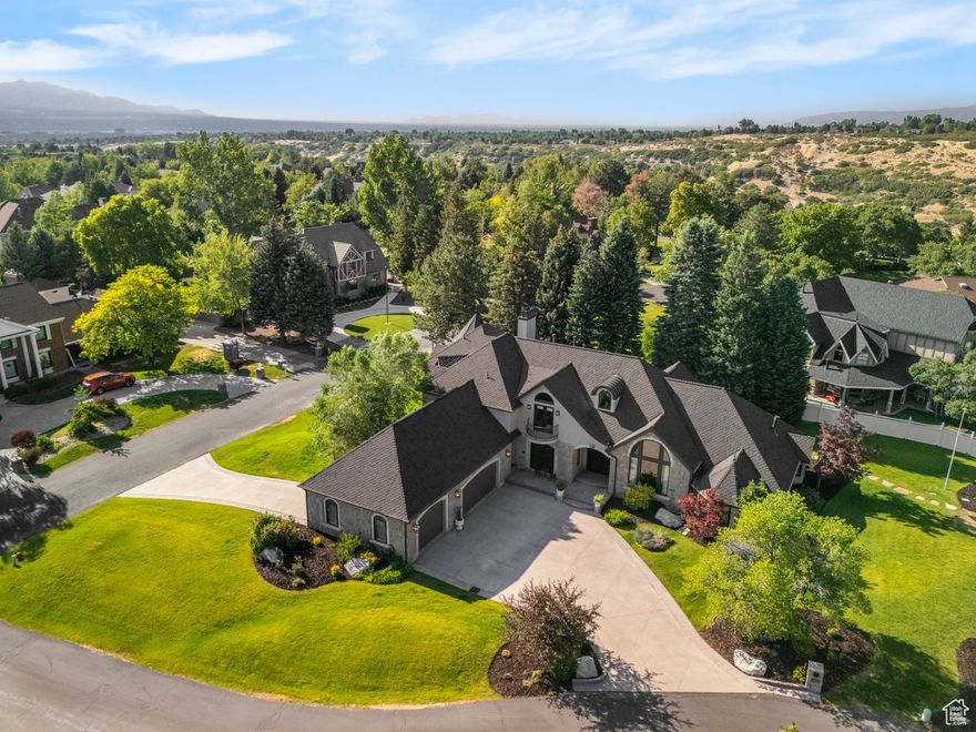 Experience the perfect blend of luxury, privacy, and community in this exceptional custom home located within 477 acres of the prestigious 24-hour guard-gated Pepperwood community. Tucked away on a quiet cul-de-sac and set on a generous .57-acre lot, this residence offers a rare opportunity to own in one of the Wasatch Front's most secure and sought-after neighborhoods.  From the moment you arrive, you'll be captivated by the home's commanding curb appeal-now enhanced with brand-new siding, striking stone turrets, all-new exterior lighting, and a new 50-year roof that adds long-term value and timeless style. All-new glass and exterior doors elevate the architectural character while improving efficiency and natural light throughout the home.  Step inside to a fresh, refined interior featuring brand-new wool carpeting throughout and a flexible floor plan designed for both elegant entertaining and relaxed day-to-day living. The main-floor primary bedroom suite is a true retreat, offering soaring ceilings, dual walk-in closets, and an en-suite bath with a deep soaking tub and separate shower-perfect for main-level living.  The kitchen features a unique yet timeless design that blends form and function. With a layout that promotes connection and convenience, the space includes high-end finishes, ample cabinetry, granite countertops, and a large center island. It's ideally suited for everything from casual family breakfasts to large-scale entertaining.  Adjacent formal and informal dining and living areas, enhanced by multiple fireplaces and expansive windows, create a welcoming and elegant atmosphere throughout the home.  Upstairs, guests and family members will enjoy spa-like comfort in fully remodeled bed/bathroom on-suites featuring heated marble tile floors, quartzite countertops, and new custom showers-each space designed with quality and style in mind.  Step outside to your own private oasis-a beautifully landscaped backyard framed by mature trees, stone patios, and open space ideal for relaxing in the large spa or entertaining around the fire pit . There's ample room to bring your outdoor vision to life, whether you're imagining a pool, sport court, or garden retreat.  Residents of Pepperwood enjoy access to unmatched amenities across its 477 gated acres, including private walking/biking trails, sand volleyball court, tennis, basketball and pickleball courts, a resort-style pool, lifeguards, pepperwood competition swim team, playgrounds, club house and a vibrant calendar of year-round community events.   Perfectly situated just minutes from world-class ski resorts, scenic hiking and biking trails, top-rated schools, and premier shopping . This home offers an extraordinary blend of luxury and lifestyle.  Don't miss your chance to own this beautifully updated and professionally designed residence in one of Utah's most iconic and desirable communities. Schedule your private showing today and experience the elegance and security of life in Pepperwood.Sq Footage from previous MLS