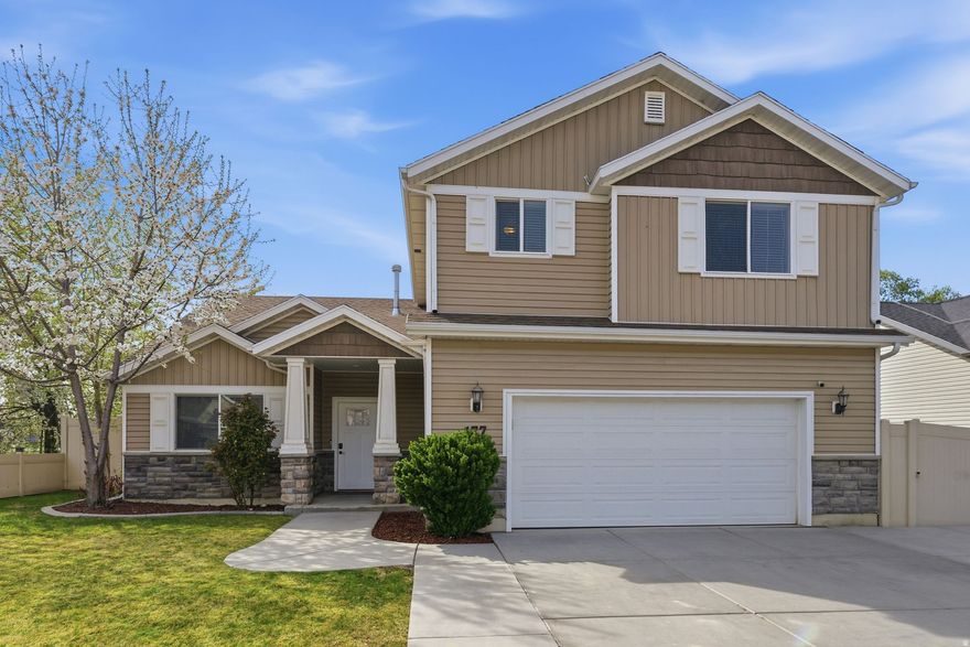 Enjoy the many upgrades this beautiful home has to offer! Thoughtfully designed for comfort and flexibility, the home features two primary suites-one conveniently located on the main level and another on the upper level-perfect for multi-generational living or added privacy.  The oversized kitchen, with island, offer abundant counter space and cabinetry.  The inviting great room is anchored by a cozy gas fireplace, creating the perfect spot to relax and unwind.  Washer and dryer hookup are on both levels, making this home an excellent option for a potential mother-in-law setup. A murphy bed has been added to the upstairs loft, adding additional space for overnight guests.  The current owner has added some incredible upgrades, including solar panels with a battery backup system (installed in 2021).  Step outside to a beautifully enhanced outdoor space featuring over $40,000 in landscaping and concrete work for you to enjoy.   A new water heater and water softener have also been recently added.  Ideally located in a desirable area close to shopping, dining, and everyday amenities, this home offers the perfect combination of upgrades, comfort, and convenience.