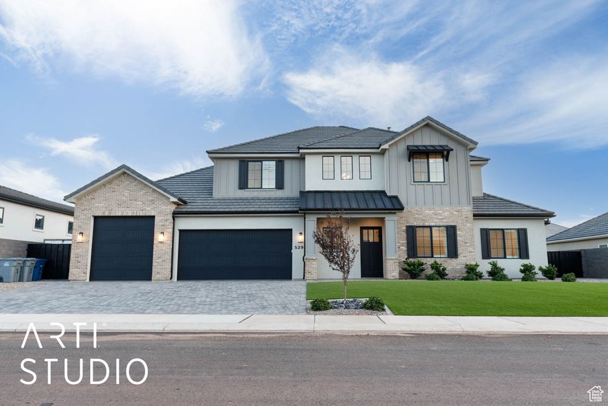 Stunning home in the highly desirable Sycamore Village subdivision. Perfectly situated near Southern Utah's top outdoor destinations, including Sand Hollow Lake, the Sand Dunes & Sand Hollow Golf Course. Boat garage great for all your toys in Southern Utah!  Inside, the open-concept floor plan is designed for modern living, highlighted by expansive picture windows that flood the home with natural light. The main level offers a second bedroom + an office, while the luxurious primary suite showcases exquisite tile work, dual vanities & a spacious walk-in closet. Step outside to a fully landscaped backyard with low-maintenance artificial turf, block walls on all three sides, and custom iron gates. Combining comfort, convenience, and exceptional craftsmanship, this home is a must-see! Owner/agent.