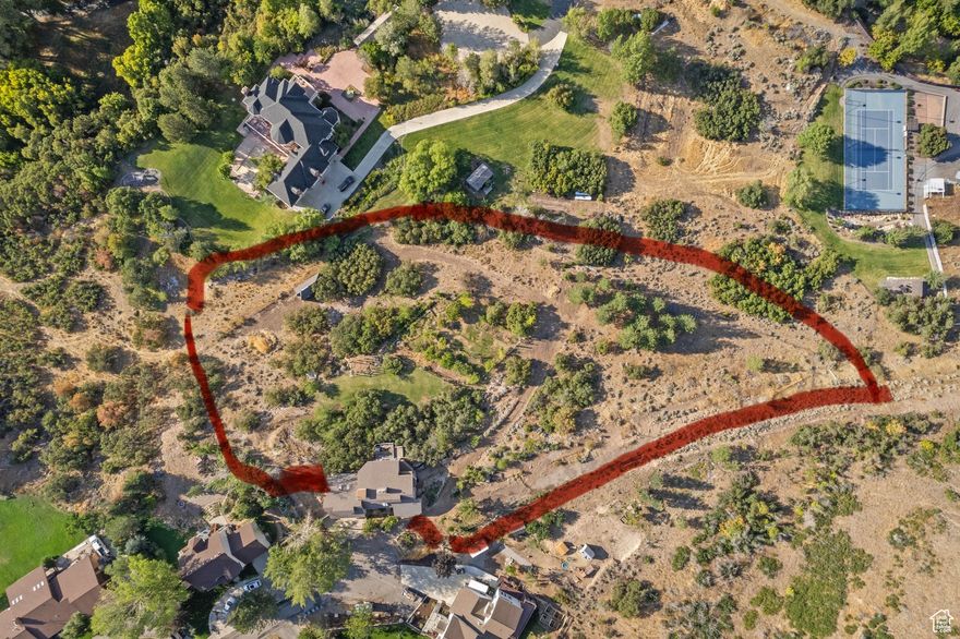 Rare 2.1-Acre Lot in Mapleton  Views, Orchard & Pines property is truly a hidden gem, offering one of the best lots and locations in Mapleton. With panoramic mountain and valley views, a mature pine forest, and a large established orchard, this land is full of character, privacy, and opportunity. From sunrise to sunset, the scenery will take your breath away and provide the perfect setting for peaceful living. The property currently includes a two-bedroom, four-bath residence with an unfinished basement. The home is a fixer-upper and may not qualify for traditional financing, but it offers exciting potential. With several basement entrances, the layout is ideal for adding an accessory apartment or creating separate living spaces. Whether you choose to restore the home, rebuild, or design a brand-new vision, this property gives you the flexibility to shape it into exactly what you want. Property will be sold as-is. Sellers will make no repairs