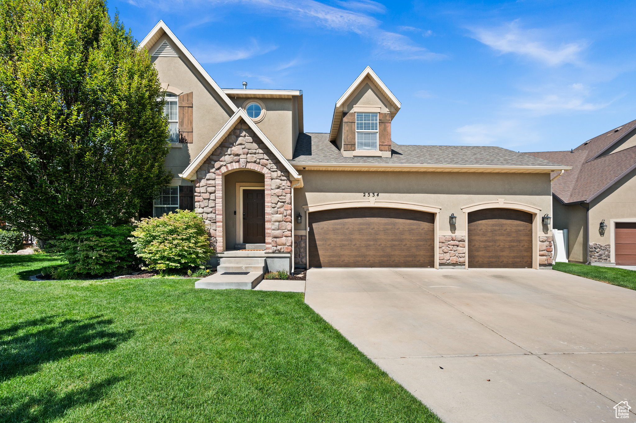 Welcome to a home that blends modern updates with low-maintenance living in a secure gated community where the gates close every evening and remain closed all day on Sundays, giving you extra peace of mind while enjoying everything this neighborhood offers. Inside, the owners have refreshed nearly every detail with new paint, plush carpet, updated bathrooms, and a stylish kitchen renovation that reflects today's modern trends. The main level feels bright and welcoming with hardwood floors, vaulted ceilings, a newer fireplace at the heart of the living space, and a spacious owner's suite that provides true main level living, while right inside the front door is the perfect spot for an office. Upstairs you'll find two additional bedrooms plus a versatile flex space that works beautifully as a playroom, office, or reading nook. The fully finished basement extends the living area even further with a kitchenette and plenty of room for guests, hobbies, or movie nights, while a newer water heater, furnace, a/c, garage doors, radon mitigation system plus a water softener provide ease and confidence in your investment. One of the best parts is that the HOA takes care of all front and backyard landscaping so you'll never mow again, giving you more time to relax on your patio or take advantage of the community amenities including the clubhouse gym, swimming pool, and playground just across the street. This home is more than a place to live, it is a lifestyle of comfort, security, and connection waiting for you.