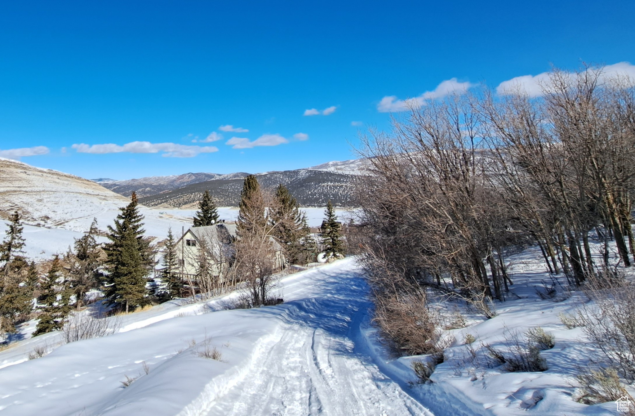 CALL FOR ROAD CONDITIONS AND GATE CODE BEFORE GOING TO THE PROPERTY. 4X4 OR CHAINS REQUIRED Driveway to the cabin above has a legal easement in place. The site plan was approved by summit county in 2022 but will need to be resubmitted. The buyer and buyers agent would need to contact summit county engineering to verify. Lake Rockport Estate is a year accessible community. Most of the homes/cabin are year round residence. The roads are plowed by volunteer. The water is seasonal, the residence use water storage tanks that are under ground or in the home for winter water. Culinary summer water is available from the HOA.