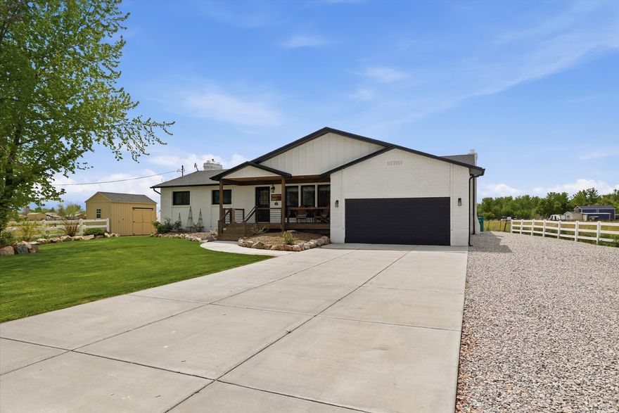 This high end, AMAZING remodel & addition was completed the end of 2024! Your excitement will grow as you begin to tour the home and property. There are so many WOW factors, it is hard to know which one will be your favorite. Will it be the 43x30 attached garage, or the gorgeous kitchen with 36' range along the high end interior finishes linked to a butler panty plumbed for 3rd sink, or the 6 total fireplaces that each create an offering of warmth, comfort & serene outdoor living spaces (4 indoor & 2 outdoor).  Perhaps it could be the 4.62 acres that provide amazing mountain views and open landscape, along w'3 water shares that provide the irrigation to sustain the property and desired  animals. Not to mention the possibility of business ventures, or just space to breathe. Subdividing into multiple lots is also a potential option, Seller has already drawn up a 3 lot plan & had it surveyed (if interested, Buyer to verify with city for details). The layout of the home also provides options for a MIL apartment/generational living. The Barn is 38x38 with power and water and new 9.9x12 quiet garage door, w'lean to off to the side perfect for the boat or RV. Carport shed is 25x20 w'closed in area and rollup door. Also a 8x14 Shed w'power.  2 separate a/c&furnace systems (front 2017 & addition 2024 Daikin Fit system)  Upgrades include Anderson Renewal windows, New Septic System, Smart tankless water heater, Smart sprinklers in fenced in area & front yard, Upgraded power panel & meter (a Conduit runs along east boarder for additional power option to barn, etc.). This is truly a luxurious farmhouse that captures desired views, peace and quiet while still providing the convenience of nearby city amenities.