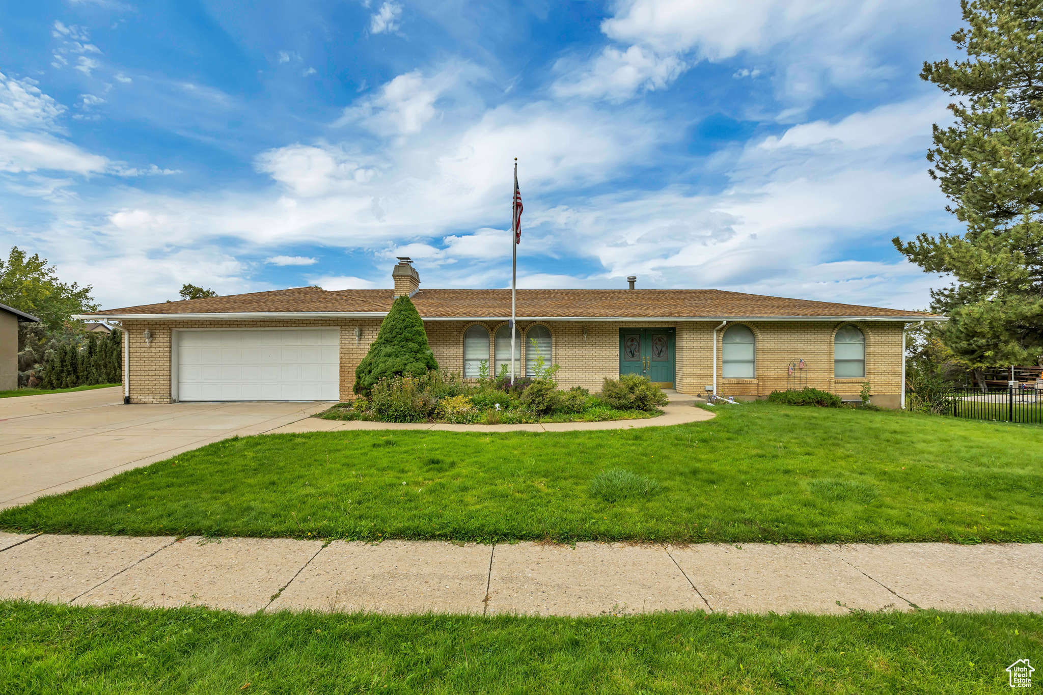 All-brick home on Bountiful's east bench with over 3,000 sq ft, 6 bedrooms, and 3 full baths. Features include two family rooms with stone fireplaces, arched front windows, a primary suite, and a huge laundry room. Walk-out basement with brand-new carpet and updated LVP flooring. Mature trees, manicured yard, and incredible valley views from the back deck. Two-car garage with a large RV Pad. Well-kept and move-in ready in a pristine neighborhood. Call or text to come and see it.