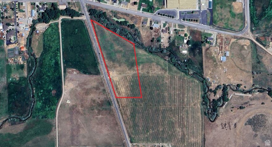 Beautiful farmland along Highway 132 in Moroni with 3 shares of City Ditch (Legacy) water. This is your ideal piece of land with opportunities to farm, build a home, or just land bank. An additional 5 acres is available (MLS #2079952) with water *that is pressurized* and adjacent to this acreage. This parcel is within Moroni city limits and zoned Commercial but can be rezoned with proper zoning application. More water is available for sale.