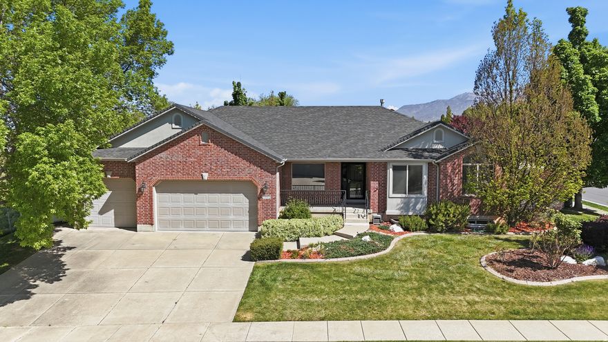 Beautiful East Layton rambler tucked in a quiet, south-facing cul-de-sac. This custom-built, two-owner home has been fully finished and meticulously maintained, offering 5 bedrooms and 3 bathrooms with thoughtful upgrades throughout. The updated kitchen features KitchenAid Pro Line appliances, a farmhouse sink, and custom cabinetry, complemented by stunning Carlisle wide plank pine flooring. Brand new paint throughout Main Level. Enjoy multiple living spaces including a formal living room and two comfortable family rooms, along with two Lennox fireplaces with custom mantles. The custom theater room is equipped with a riser and wired 7-point surround sound. Ample built-in storage, large storage room, and cold storage provide exceptional functionality. Major systems are in great shape, including HVAC,  water softener, and dual water heaters. Ideally located near Hwy 89, I-15, schools, parks, trails, and world-class skiing-this home truly checks every box.