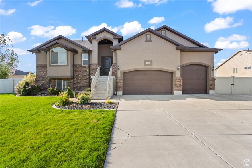 HUGE price adjustment! Spacious and inviting, this well maintained four-bedroom three full bath home offers the perfect blend of comfort and style! Open concept living with plenty of light! Beautiful kitchen with stainless steel appliances. Step out onto your covered deck and enjoy relaxing while listening to your favorite music coming from the sound system on deck and downstairs! Open patio gives you all the room you need for entertaining! Check out the 24x32ft detached garage with 220 volt power! Plenty of room to park all the toys! Three car attached garage has your rv hook up inside! Wired for a hot tub! Out of the busy but close enough to schools, shopping and I-15 on ramp for convenience!