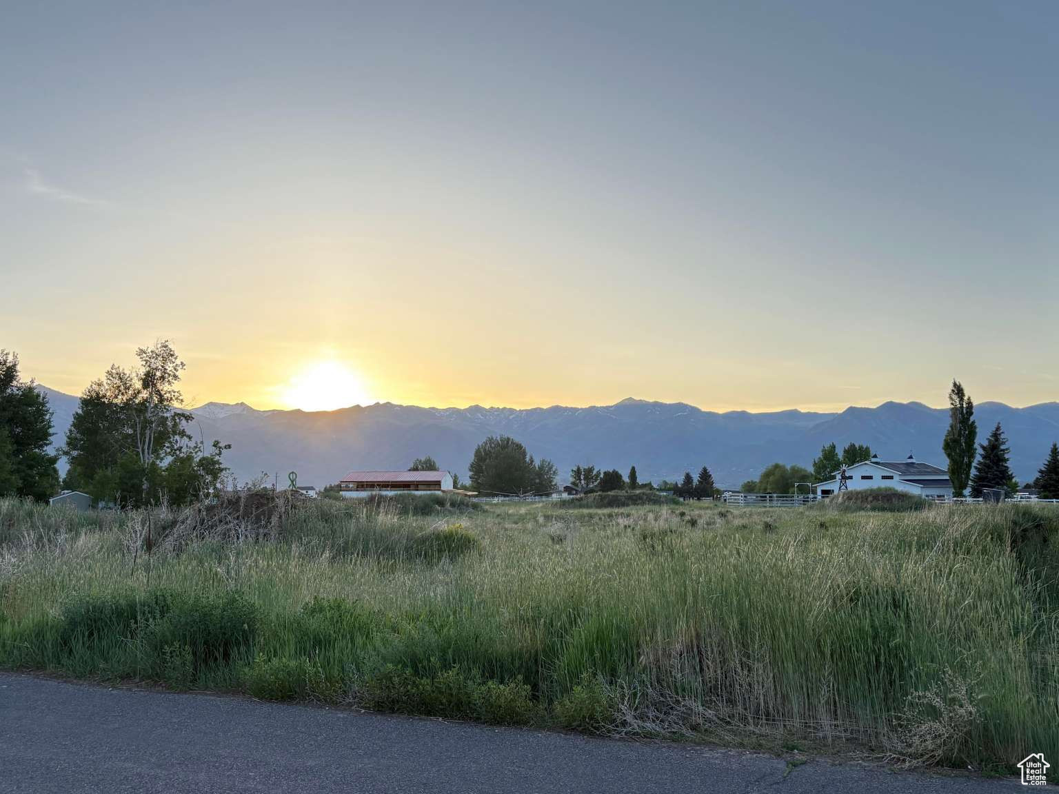 MUST SEE 2+ acre lot in rural Heber. Animals welcome. Sunsets over Timpanogas. Amazing neighbors. NO HOA Fees or crazy building rules. Quiet neighborhood with NO traffic running through it. Quick access to the highway. Includes 2 water shares and is ready to build on! This property has amazing neighbors on all 3 sides of it. As you can see from the Google map image, I had plowed a driveway along one side of the property to go to the back of the property and filled it in with road base. The topsoil was scraped and placed in a couple of piles on the property for use in the future yard. When we purchased the property it did not have water shares with it. By the time we were able to track them down, we had purchased a different lot and drew up plans. If you are looking for a quiet country neighborhood without being far from town, THIS is the place!