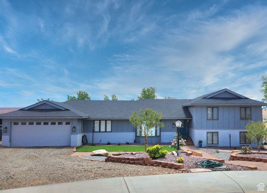 Here's your chance to own this rare gem in one of Page's most desirable areas -- steps from the Lake Powell National Golf Course with sweeping panoramic views! This spacious 6 bed, 3.5 bath home offers unobstructed views of the Vermilion Cliffs and backs to open hiking trails, preserving your scenery for years to come. Inside, enjoy hardwood, tile, and carpet flooring. The remodeled kitchen (2017) boasts granite counters, double ovens, and ample space for entertaining friends and family. Updated bathrooms include granite surfaces and cozy heat lamps. Major upgrades: new roof, 2 water heaters, electric heat pump, updated electrical panel, and fresh paint -- inside and out. The large, climate-controlled basement offers endless possibilities -- think gym, game room, theater, or extra bedrooms! Outside features a covered Trex deck with hot tub, lighted basketball court, mini golf area, RV hookup, and metal pull-through boat storage. Fully landscaped with a watering system. Location, location with all the conveniences in the heart of Page.  Sold fully furnished-ideal as a primary home, vacation getaway, or rental. Call Mustang Realty today! Buyer to verify all.