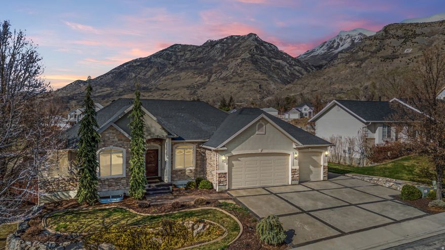 NOT your cookie cutter rambler- located in a PRIME location of East PL. Grove. High end designer finishes throughout & seperate entrance to the basement is already pretty much ready to go for an ADU! 2 seperate furnaces, custom pergola over the deck that feels like extended living space includes, firepit, large deck, outdoor speakers and access from the Primary Suite. Your pets will love the custom doggie door and easy access to/from laundry room. Walking distance to HS and Murdock Trail, Gorgeous mountain, valley & lake views.  This one has it all!