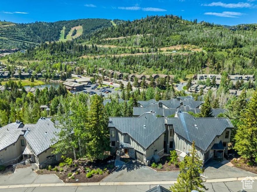 Discover the perfect blend of comfort, elegance, and location in this spacious 4-bedroom Pinnacle townhome, ideally situated in the coveted heart of Deer Valley. Designed with timeless appeal and effortless entertaining in mind, this home boasts a sought-after downhill floor plan and expansive, light-filled living spaces. Soaring vaulted ceilings and wall-to-wall windows in the great room frame panoramic mountain views, while flooding the space with natural light. The open-concept dining and living area flows seamlessly to multiple gathering zones-including a billiards room with a wet bar, a cozy lower-level den, and generous outdoor decks-offering plenty of room for large groups or multiple families to unwind and connect. A private hot tub adds the perfect finishing touch for relaxing aprs-ski evenings. Whether you're searching for a tranquil mountain retreat or a high-performing vacation rental, this townhome delivers on all fronts. Located just minutes from world-renowned skiing, scenic hiking trails, and award-winning dining, this is a rare opportunity to own in one of Deer Valley's most prestigious communities.