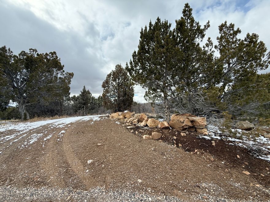 **Power, water and septic are connected, with a driveway and pad, ready to use now** Year round access, and beautiful views, for a primary mountain residence or a peaceful weekend retreat.  Build a cabin/home or park your trailer or RV and enjoy the cool, crisp mountain evenings, as you get away to country living. *Survey corners are marked* Enjoy the private pond where you can fish, paddle board, kayak, play on the beach, and enjoy the island and dock. Gas would be propane tank. Internet is hard wired or broadband wireless but would be added after purchase Nearby you will find four-wheeling, hiking, hunting, rock climbing, snowmobiling, snow shoeing, lakes, camping and other outdoor activities. Close to Manti-La Sal National Forest and Skyline Drive Trail System. Mt Pleasant has a grocery store, hardware store with a lumber yard, hospital, restaurants, drive-in theater, community pool and other small town amenities. MLS map is correct. Google Coordinates:  39.481135, -111.421234  All information within is provided as a courtesy only. Buyer and Buyer's agent are advised to complete their own due diligence and measurements. Lot/boundary lines are shown as approximate.