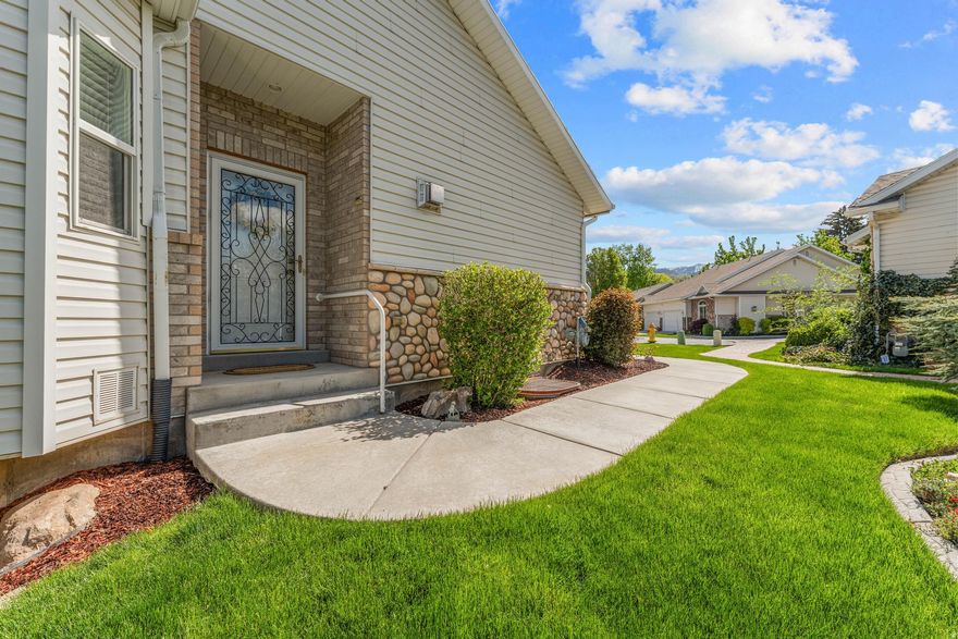 **Open House April 18, 11-2** Centrally located within walking distance to shopping! Come tour this charming, cottage style home on a private, quiet cul-de-sac. This spacious twin home features  **MAIN FLOOR LIVING** with formal living room and fireplace, large dining area with built in oak buffet and kitchen. All appliances are included.  Beautiful oak cabinets in kitchen and dining room and high end laminate flooring give this home classic finishes. Spacious main floor bedroom is finished with crown molding and uplighting. Main bath has, full tub, separate shower and large walk in closet. Upstairs bedrooms open onto private porch with gas outlet for BBQ.  Guest half bath and laundry room are also on main floor. Walk out basement with huge family room, 2 large bedrooms, 1 full bath with quartz countertops and option for 5th bedroom just waiting to be finished. Basement opens onto a covered patio and private, partially fenced back yard. HOA maintains your beautiful yard so no mowing required. *TVs, Safe and space heater are included.