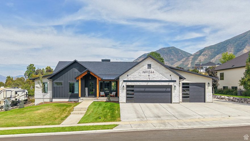 Be sure to click on the tour button to see the 3D and first person fly through tours. This stunning, fully custom, mountain-modern home is a must-see, nestled in the highly sought-after Premier Point neighborhood. Designed with a blend of contemporary elegance and functionality, it boasts top-tier finishes and architectural details throughout. Features and upgrades include numerous floor to ceiling windows, modern cabinetry, quartz countertops, double ovens with a separate cooktop, vented hood, LVP throughout, custom modern railings, 9ft ceilings on the main and basement, double sided fireplace, motorized shades, large shower with double shower heads, separate tub, double vanities, spacious walk-in-closet, jack and Jill bath, large butlers pantry, large covered deck, vaulted ceilings and recessed lighting throughout. An office off the kitchen features large windows that provides a bright, inspiring workspace, offering panoramic views and its own private patio. Spacious five car garage with added RV parking and a 240v outlet.The home is very energy efficient with a tankless water heater, high efficient furnace, and a water softener. The exquisite exterior boasts a mountain modern elevation, some metal roofing and front porch timbers. Perfect orientation with a west facing driveway that receives plenty of sun and an east facing deck for plenty of shade in the afternoons. The yard is fully finished to allow for enjoyment of the incredible views of the mountains, valley and natural trees located on the property. The walk-out basement is plumbed for a future kitchenette, has a large cold storage, and the framing has already been completed. This home is truly a masterpiece of design and functionality, combining luxurious living with modern efficiency. Perfectly suited for those who appreciate both style and sustainability, it offers everything you need for a high-end lifestyle.