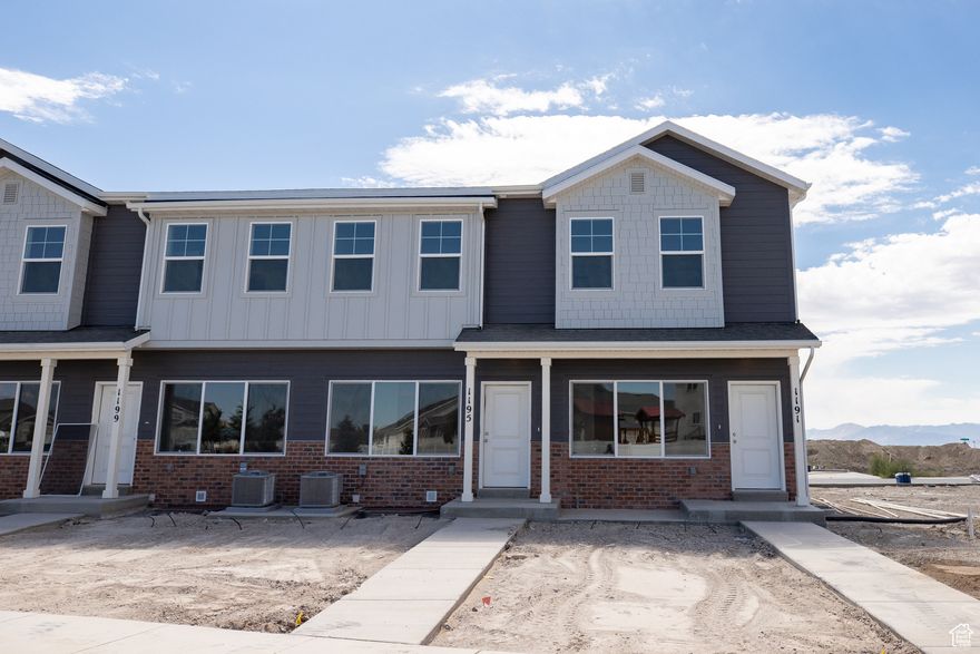 AMAZING $10,000 INCENTIVE towards closing costs, rate buydown, or price reduction regardless of lender! Plus, this home qualifies for Utah's First-Time Homebuyer Program-giving you up to AN ADDITIONAL $20,000 for down payment, closing costs, or interest rate buydown! Must-see Harmony Community in Eagle Mountain! This beautiful end unit townhome built by Flagship Homes features 9' ceilings on all 3 floors, 3 bedrooms, 3 bathrooms, a finished basement, quartz slab countertops, painted cabinets, laminate flooring on the main level, 1 car garage, and full landscaping. The primary bedroom has a large walk-in closet with dual sinks in the primary bathroom. This townhome is move-in ready. Call for more information or stop by our model home at 3859 N. Thomas St., Eagle Mountain for a tour. Model home hours: Monday-Saturday 11 AM - 6 PM. Buyers to verify all information. Square footage is from house plans.