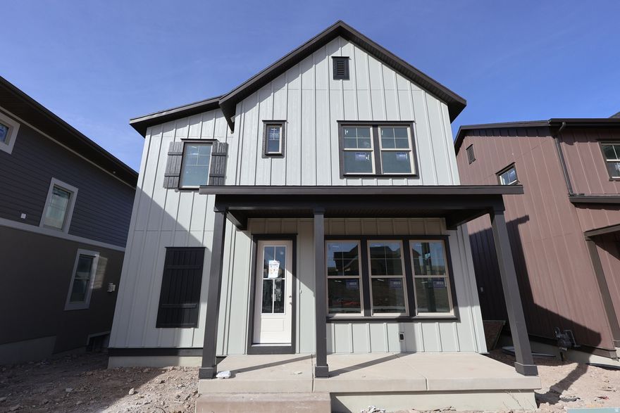 Designed to maximize natural light, this home showcases plentiful windows, inviting covered front and rear porches, and a fenced backyard ideal for entertaining or relaxing.