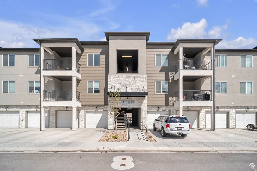 Beautiful, friendly community where everything is just minutes away. This top-floor 3 bedroom, 2 bathroom condo, built in 2023, is like new and stands out from builder listings with the added advantage of appliances already included: washer, dryer, and refrigerator. The open-concept layout is filled with natural light and offers a modern, clean design throughout.  Enjoy your private balcony, along with the convenience of a private garage plus additional parking. The property has been meticulously maintained and is in immaculate condition, making it truly move-in ready.  Community amenities include a clubhouse, swimming pool, and scenic walking and biking trails, all with an affordable HOA.  This property is being offered as a SHORT SALE and represents an excellent opportunity to own a beautiful, nearly new condo in a highly desirable community at a compelling value.  Don't miss this opportunity-schedule your private showing today!