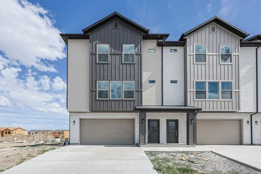 End unit just finishing.  Super Open floorplan that is perfect for gathering! 9' main floor ceilings. Gorgeous LVT floors throughout the main floor and baths. Huge Garage that fits a mega-cab truck and a car. Kitchen features an upgraded Black Kitchen sink & Faucet, Huge pantry, 39" upper cabinets, and a  7' kitchen island, Large Owner suite w/ ceiling fan and WIC. Covered Deck. Come see our Decorated model home.  No PMI 100% financing available.  Preferred Lender incentive!