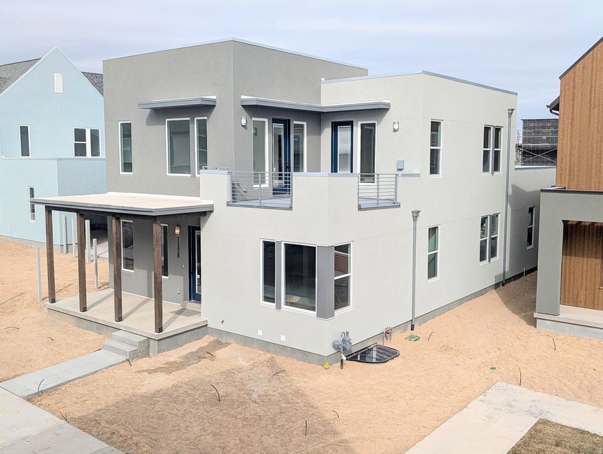 Move-In Ready, Brand New Home with Spacious 3-Car Garage! This home includes a fully finished basement and stunning designer upgrades such as quartz countertops throughout, a wet bar, gas range, upgraded cabinetry, hard surface flooring, and more. The open floor plan features a generous great room that flows seamlessly into the dining area and kitchen, complete with a large island and walk-in pantry, perfect for entertaining. The impressive primary suite boasts 12-foot ceilings, an oversized walk-in closet, a luxurious en-suite bathroom, and direct access to a hot-tub-ready balcony with breathtaking views.