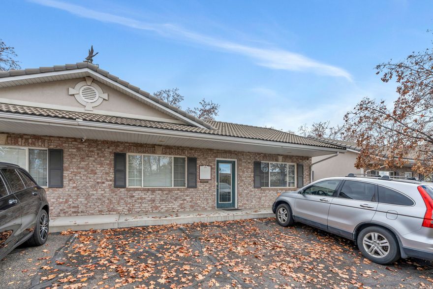 This well-maintained rambler-style office building with a fully finished basement offers a versatile and professional setting in a highly desirable Orem location, just moments from University Mall. The main floor features four private offices, conference area, and a conveniently located bathroom-ideal for client meetings, team collaboration, or individual workspaces.  The finished basement with exterior entrance, adds valuable flexibility with two additional offices, a second bathroom, and a compact kitchen area perfect for breaks or light food preparation.  Constructed with a classic brick exterior and topped with a durable tile roof, the building presents a clean, established appearance that complements the surrounding professional and retail environment. Its accessible layout and excellent proximity to major amenities make it a strong choice for a wide range of business needs.