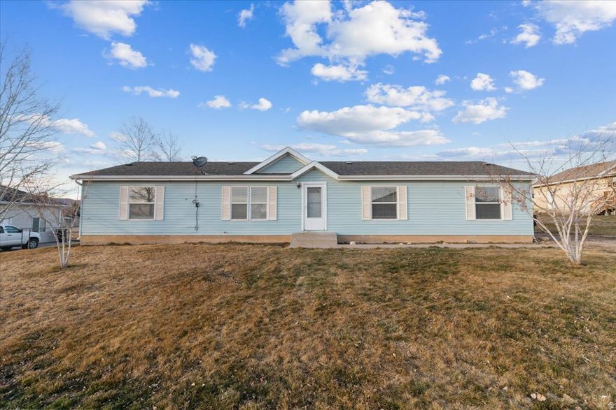 Welcome to this charming 3-bedroom, 2-bath modular home in the heart of Fairview, Utah! Situated on a spacious quarter-acre lot, this property offers the perfect blend of comfort, functionality, and small-town living. Inside, you'll find a bright and inviting layout with generous living spaces and a practical floor plan designed for everyday living. The fully installed sprinkler system keeps the front and side yard looking its best, while the backyard offers a unique, low-maintenance setup featuring multiple mature fruit trees-perfect for enjoying fresh harvests right at home. With beautiful mountain views and room to relax, garden, or entertain, this property is a wonderful opportunity to enjoy peaceful living in a scenic Utah setting.