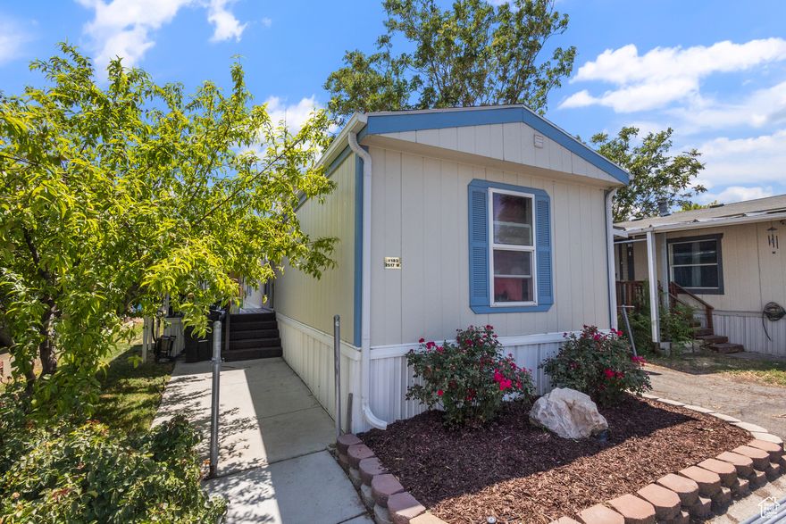This charming home blends comfort and convenience with thoughtful updates throughout. Inside, durable LVP flooring complements the spacious kitchen and living area. Step out onto the newly built deck (2024) and enjoy a freshly landscaped backyard with lush grass and fruit-bearing peach and apricot trees. Recent upgrades include exterior paint, swamp cooler, water heater, and gutters. Located in a peaceful community offering a pool, gym, clubhouse, and extra parking. Just minutes from shopping, dining, TRAX, and easy freeway access. A great elementary school is just a short walk away. ITIN financing available through 21st Mortgage and VMF.  Square footage figures are provided as a courtesy measurement. Buyer is advised to obtain an independent measurement. Buyer and buyer's representative to verify all information.