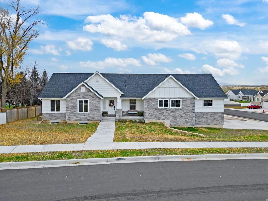 Better than new, Main Level Living home with potential Mother-in-law suite or ADU.  Be greeted every morning by the Gorgeous views of the Mountains right from your own front door!   Enjoy a meal in this spacious, well designed eat-in kitchen with island and walk-in pantry. There's dining space and a living room all on the main floor so even if you're on dish duty, you can still be part of the action.  3 bedrooms complete the main level. Including a Master Suite with walk in shower and closet. The backyard includes a trex deck and concrete patio.  Keep your vehicles and toys protected from the elements in the extremely large garage!   This home also features a separate covered entrance to the basement with custom concrete ramp.  This potential ADU opens to a living room and continues on to a full kitchen, dining and family room area.  Just off the kitchen area, you'll find a huge master bedroom and ensuite bathroom.  There is potential to add washer and dryer hookups just inside the utility room.  Check out the massive cold storage room which runs the full length and width of the porch! Terrific supplemental income potential.    *Square footage figures are provided as a courtesy estimate only and were obtained from appraisal.  Buyer is advised to obtain an independent measurement.