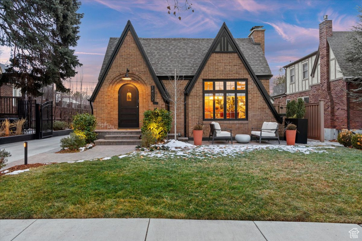 Set on idyllic Laird Avenue, this turnkey home offers the perfect package of contemporary comforts and historic charm. The arched doorway, steeply-pitched roof, and leaded-glass windows are indicative of the superlative craftsmanship imbued in homes from this era. While you're sure to be swept away by the exterior's striking character, you'll be equally impressed by the recent updates that add immense value to the property.  Inside, you'll find that every square inch of this home has been tastefully updated to optimize functionality while still maintaining the home's architectural authenticity. Warm and durable engineered hardwood flooring graces the main and upper levels. The open kitchen includes a breakfast bar, double oven, and sleek black cabinetry. Also on the main level is the primary suite, with walk-in closet and a luxurious ensuite. The attic has been converted into a versatile space and the finished basement offers two additional bedrooms with a bathroom, as well as a family room and well-appointed laundry room. Other amenities include a recently constructed detached garage, updated walkways, patios, and driveway, as well as inviting vine-covered pergolas and maintenance-free artificial turf in the backyard. Salt Lake City's distinguished Harvard-Yale neighborhood is known for its architecturally significant homes, enormous shade-giving sycamores, and proximity to the University of Utah and downtown.