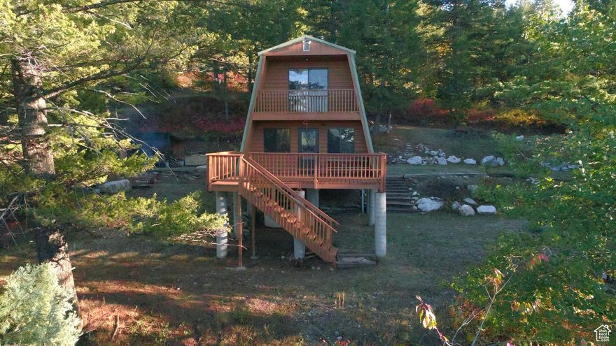 Relaxing Off-Grid Hideaway in WELL-MAINTAINED Modified A-Frame Cabin on 5.43 Wooded Acres! Desirable Location in Lava Ranch Subdivision in Lava Hot Springs, Idaho. Enjoy the Crisp Mountain Air & Incredible Views from One of the Two Balconies or from the Large Back Deck, and Experience Wildlife Directly on Your Property! The Developed Driveway Leads You from the Cul-De-Sac Access to a Large Cleared Area Offering Ample Parking Space, the Modified A-Frame Cabin, 8X16 Foot Woodshed with 8X8 Lean-To Storage Area, 500 Gallon Propane Tank (Owned), 1,000 Gallon Water Storage Tank, Fire Pit Area, Private Septic System, and Plenty of Space for Entertaining! The Cabin is Wired with Updated Electrical and is Powered with a Generator, and it's Also Got Propane Powered Lighting and is Stubbed for a Propane Powered Fridge in the Kitchen. Plan to Drill A Well? There's Plumbing & Electrical Already Stubbed for it at the Top of the Driveway and Power is in the Cul-De-Sac. The Cabin Stays Nice and Toasty with the Wood Stove & Offers 2 Large Bedrooms Upstairs, a Full Bathroom on the Main Level, 2 Storage Closets, a Kitchen, Living Room and Dining Area. Additional Space for Future Development or Storage Space is Under the Cabin as well. Buy This Lovely Property Up and Snowmobile In To Your Personal Wonderland This Winter! Call Listing Agent to Schedule Your Private Showing.