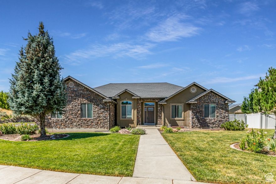 **HUGE PRICE REDUCTION** Seller will consider all reasonable offers** Welcome to your beautiful new home nestled in the heart of Morgan Valley! This amazing property is located in a peaceful cul-de-sac and highly sought-after community, offering the perfect blend of comfort, convenience and scenic mountain views. Inside you will find an open-concept floor plan with vaulted ceilings, large office and quality finishes throughout. No need to worry about repairs with a brand new A/C unit, furnace and roof are only a few years old. The spacious kitchen features granite countertops, custom cabinetry, corner pantry and island. The cozy living room includes a stone fireplace and access to the large covered patio that overlooks the fully fenced yard with mature landscaping, vegetable boxes, many fruit trees and bushes. Enjoy having fresh eggs every morning or if you prefer the seller will take the chickens when they leave. The master bedroom offers a private retreat with a walk-in closet and en-suite bathroom, complete with a jetted tub and separate shower. Additional bedrooms are generously sized and perfect for kids, guests, or a home office. Enjoy the oversized 2-car garage, RV parking, new-ish shed, and a full basement with plenty of storage and room to grow. Located just minutes from top-rated schools, parks, and outdoor adventure spots like East Canyon and Snowbasin Resort. Don't miss this rare opportunity to live in one of Morgan's most desirable locations, schedule your showing today!