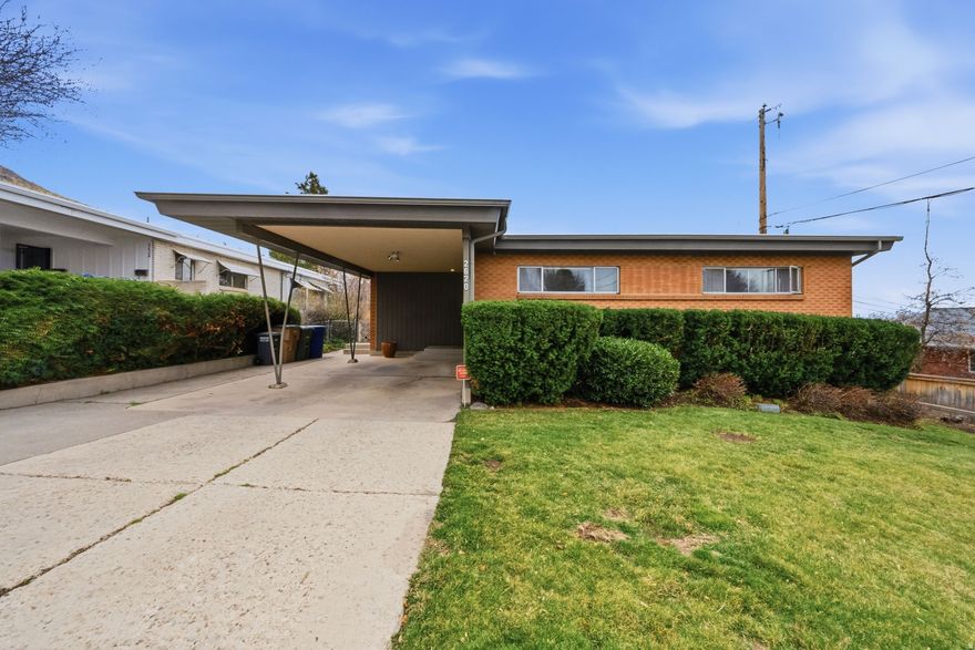 ***Open House Saturday, March 14 from 11:00 AM - 1:00 PM***Nestled near the mountains above Foothill Drive in one of Salt Lake's most sought-after neighborhoods, this mid-century modern home is filled with character and natural light. Large windows brighten the living spaces while framing beautiful views of the yard and surrounding landscape. Many original features have been preserved, including a stunning terrazzo fireplace and a back deck with a charming built-in bench. With its classic design, inviting outdoor space, and incredible setting, this home offers the opportunity to enjoy timeless style in an amazing location. Buyer to verify all MLS information,  including square footage.